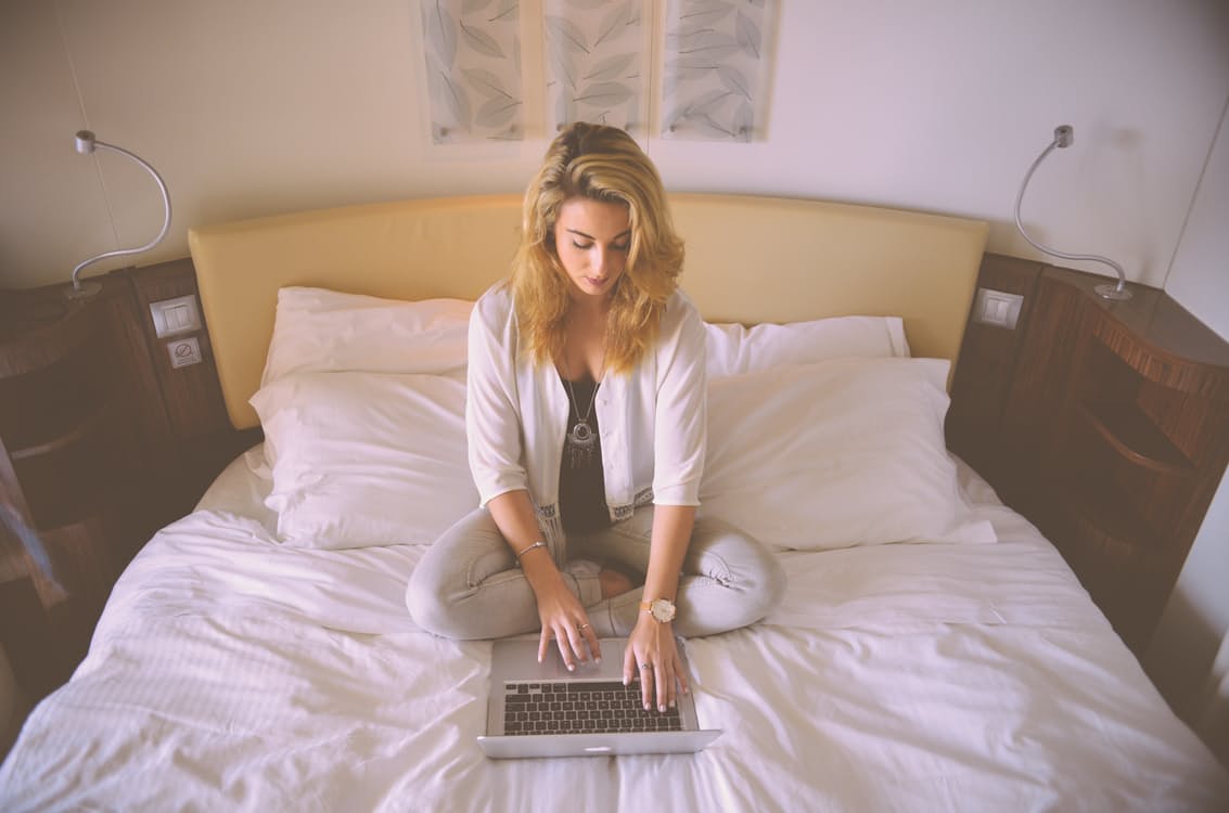 New Year's Resolutions, Woman on a bed with computer, BumbleBar