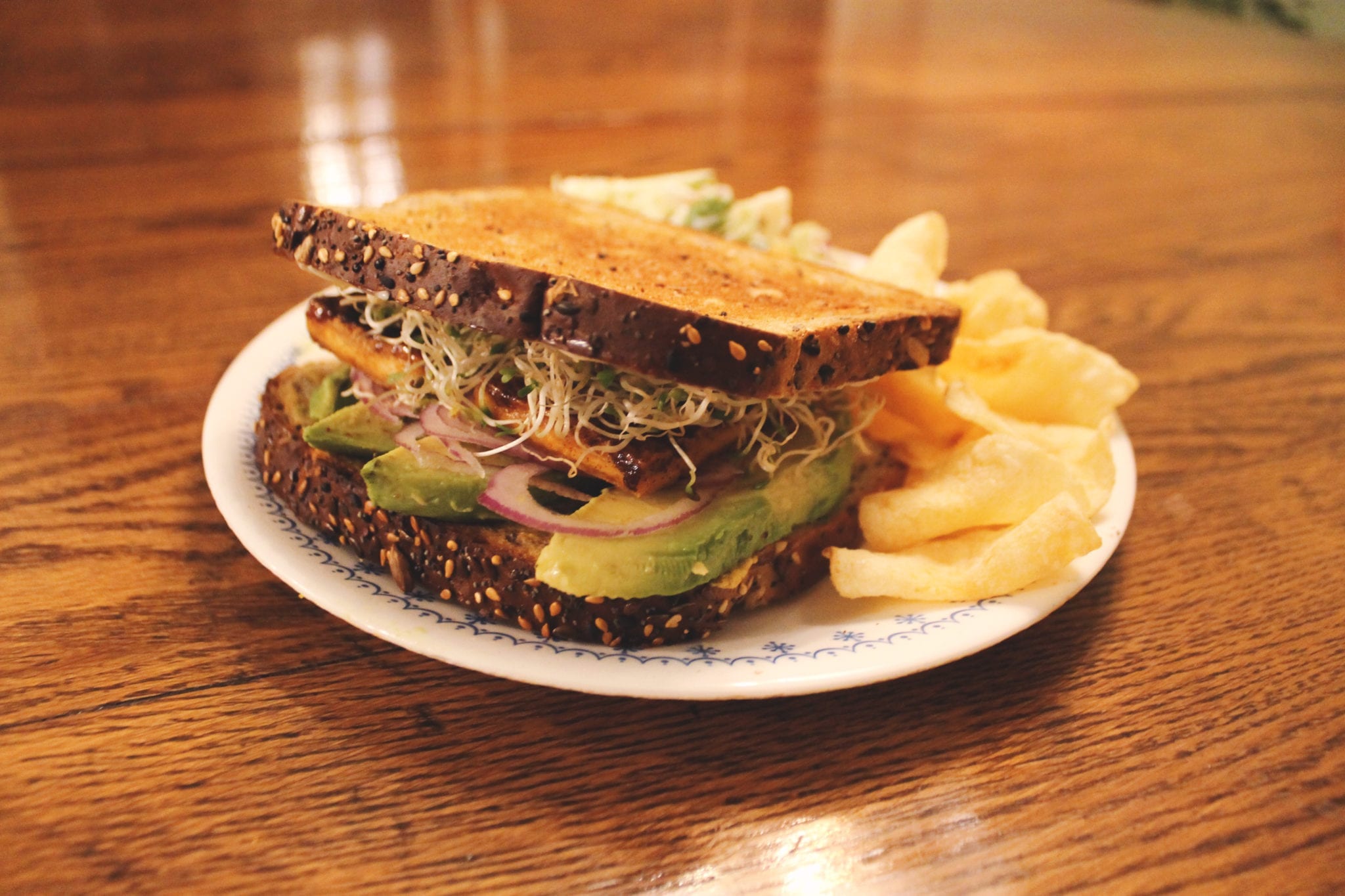 Tofu, Tofu Sandwiches, Sandwich, Tofu Sandwich, Sandwiches, Vegan Sandwich, Vegan Sandwiches, BumbleBar, Vegetarian Sandwich, Vegetarian Sandwiches, Red Onion, Alfalfa Sprouts, Olive Oil, Maple Syrup, Nutritional Yeast,  Bread, Brown Mustard, Tofu, Avocado, Salt, Paprika, Blog Post, Recipe Blog Post, Blog, Recipe