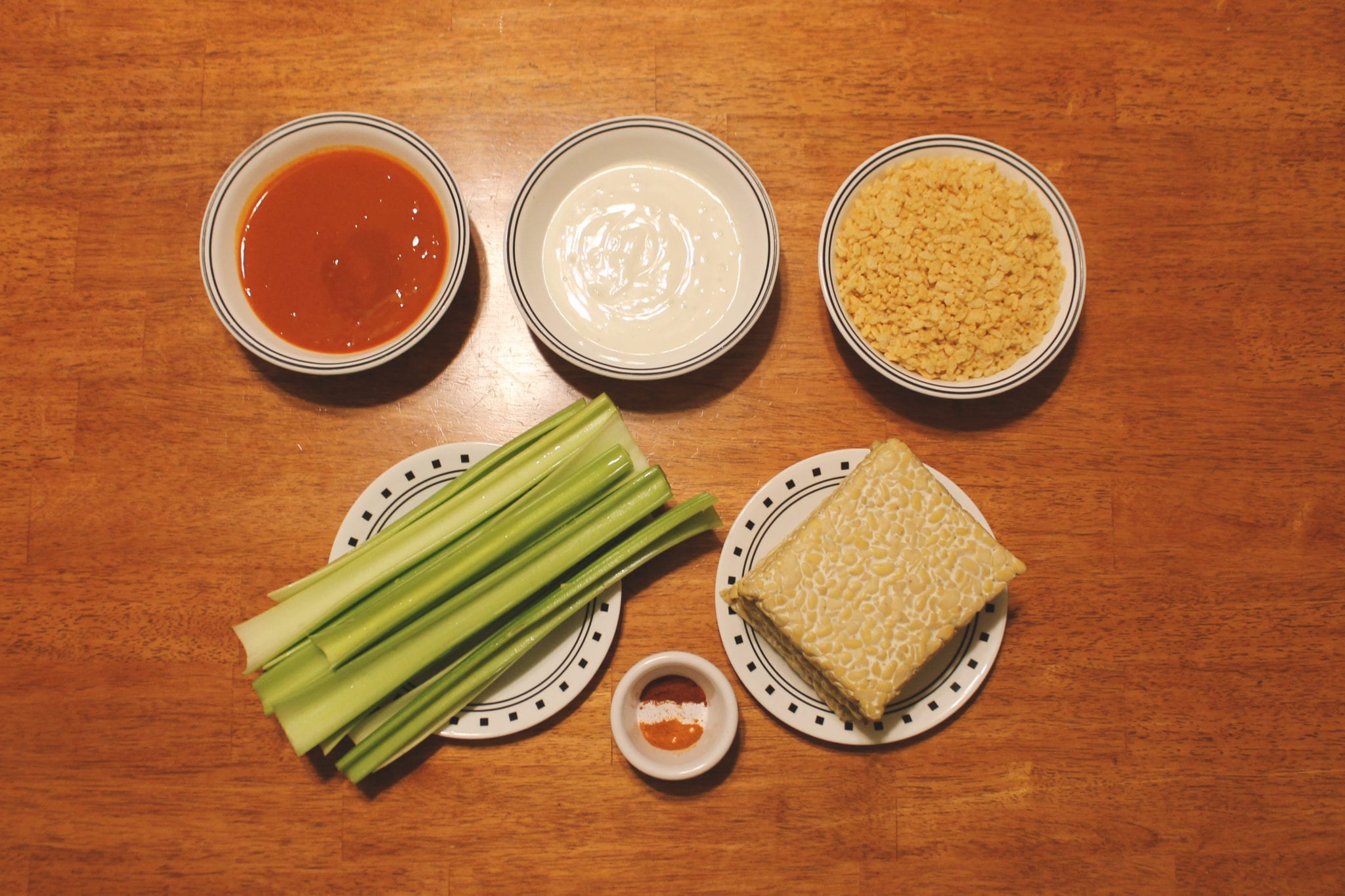 Tempeh, Plant-Based Protein, Hot Wings, Tempeh Hot Wings, Tempeh Wings, BumbleBar, Tempeh Recipe, Hot Sauce, Blue Cheese Dressing, Rice Cereal, Celery, Paprika, Cheyenne