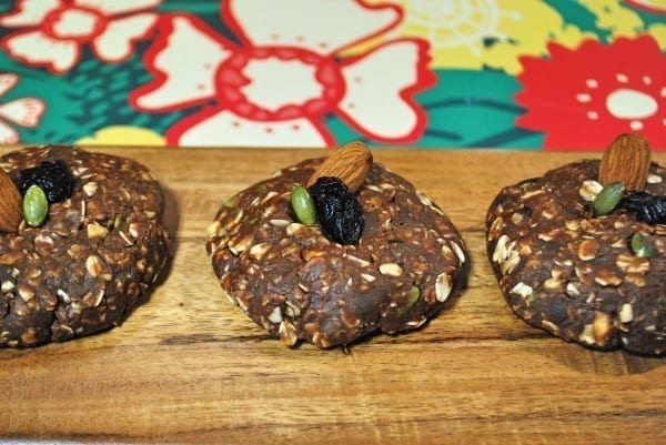 No-bake healthy holiday maca cookies on a cutting board.