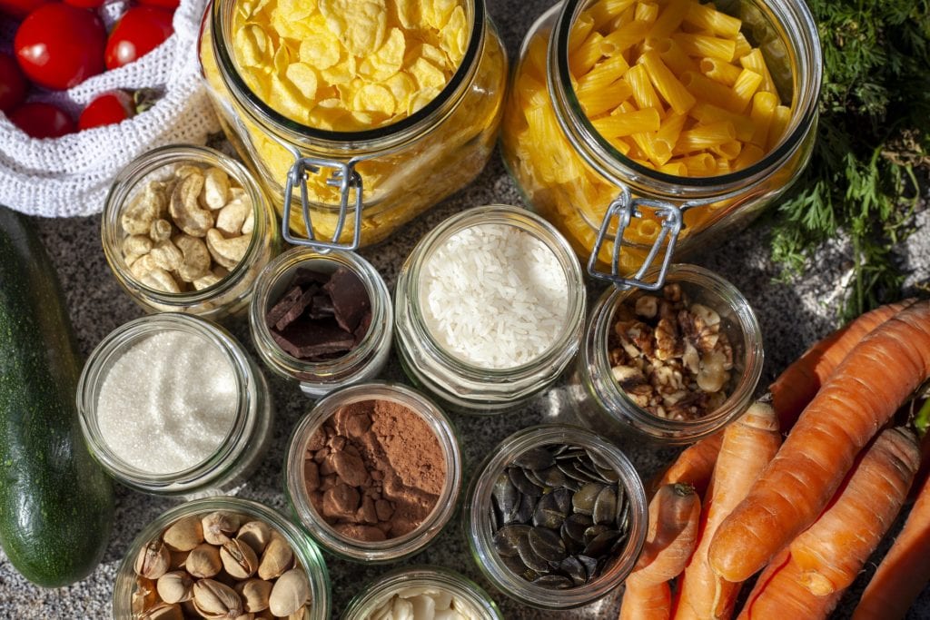 Nuts, seeds, pasta and other foods in glass jars