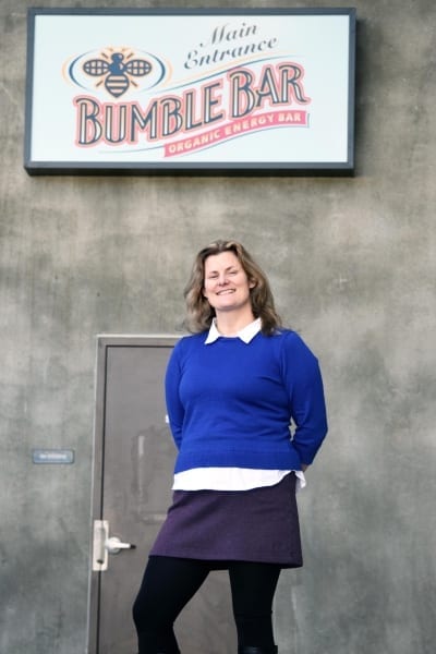 Liz standing in front of the BumbleBar sign