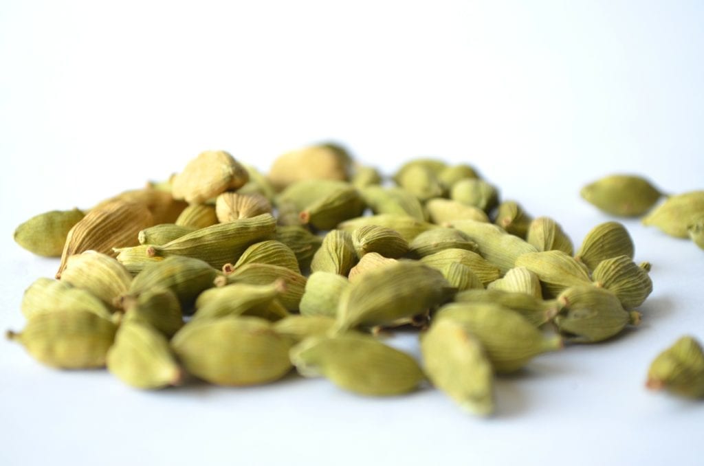 Cardamom seeds in their green pods