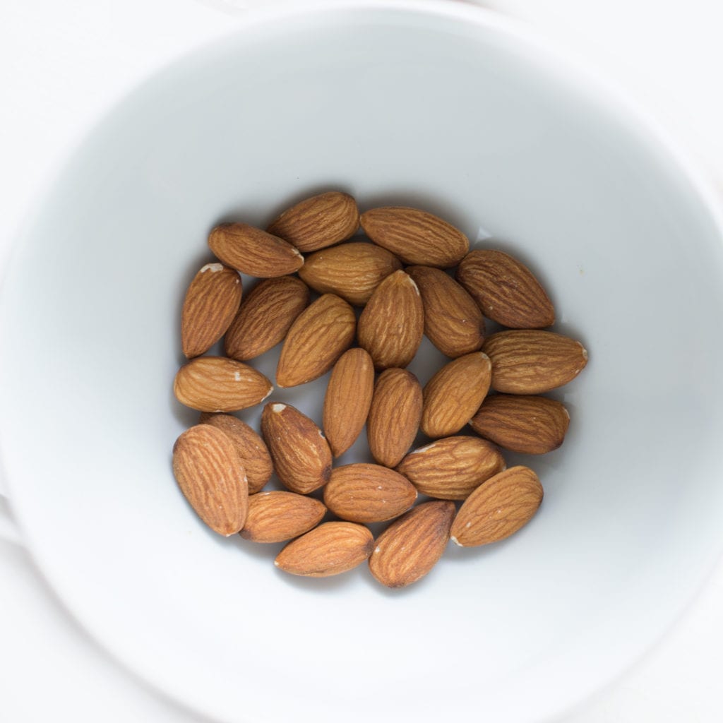Organic almonds in a white bowl