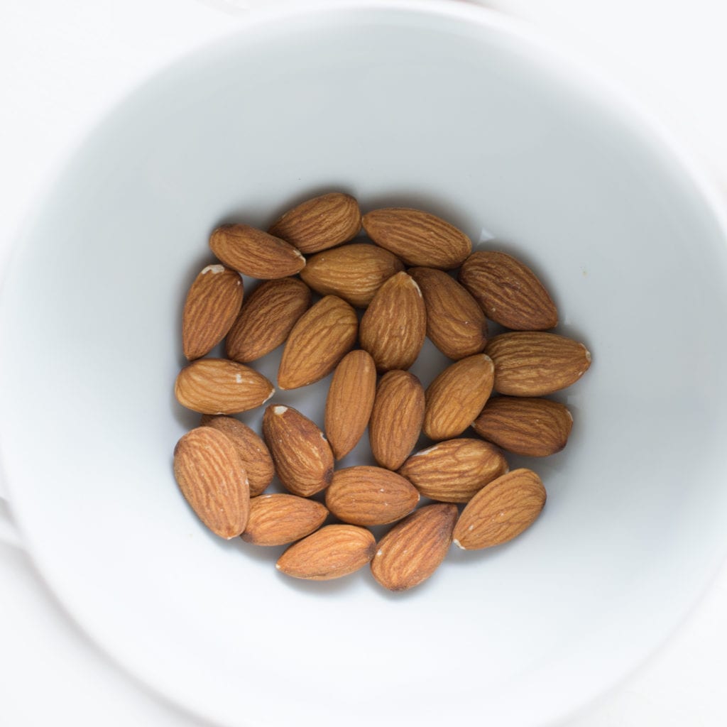  almonds in a white bowl